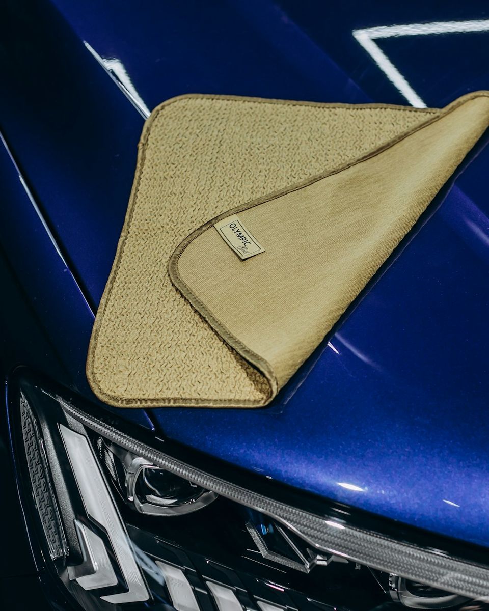 Microfiber towel on glossy blue paint